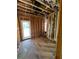 Bright living room, with rough floor and a back door to the yard, framed and ready for sheetrock at 314 Fortune Ne St # A, Atlanta, GA 30312