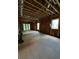 Large living room framed with exposed studs and windows under construction at 314 Fortune Ne St # A, Atlanta, GA 30312