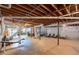 Unfinished basement space that is expansive with exposed ceiling and supports at 5670 Lanny Dr, Powder Springs, GA 30127