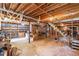 Unfinished basement space that is expansive with exposed ceiling and supports at 5670 Lanny Dr, Powder Springs, GA 30127