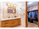 Bathroom with tile flooring, large vanity and access to walk-in closet at 5670 Lanny Dr, Powder Springs, GA 30127