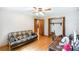 Bedroom with hardwood floors, open closet and ample natural light at 5670 Lanny Dr, Powder Springs, GA 30127