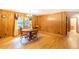 Dining room with wood-paneled walls, hardwood floors and natural light at 5670 Lanny Dr, Powder Springs, GA 30127