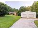 Property with home and a large outbuilding, providing ample storage at 5670 Lanny Dr, Powder Springs, GA 30127