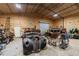 Wide garage interior with multiple old cars and mechanic equipment perfect for car hobbyist at 5670 Lanny Dr, Powder Springs, GA 30127