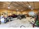 Spacious garage interior with vintage cars and equipment, offering ample storage and workspace at 5670 Lanny Dr, Powder Springs, GA 30127
