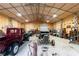 Well lit garage with cars and work benches at 5670 Lanny Dr, Powder Springs, GA 30127