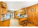 Well-lit kitchen with ample counter space and wood-paneled walls at 5670 Lanny Dr, Powder Springs, GA 30127
