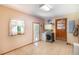 Spacious laundry room with window, tile flooring, and modern washer-dryer at 5670 Lanny Dr, Powder Springs, GA 30127