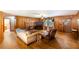 Spacious living room features wood paneling, fireplace and hardwood floors at 5670 Lanny Dr, Powder Springs, GA 30127