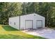 Large outbuilding with dual roll-up doors for vehicle or equipment storage at 5670 Lanny Dr, Powder Springs, GA 30127