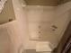 This bathroom features a white tub with white tile walls and a shower fixture at 1005 Timbervale Ln, Lithonia, GA 30058