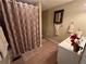 This bathroom has decorative shower curtains, neutral paint, and vanity space at 1005 Timbervale Ln, Lithonia, GA 30058