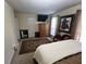 This bedroom features carpet flooring, a TV, artwork, and neutral paint at 1005 Timbervale Ln, Lithonia, GA 30058