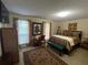 Serene bedroom with neutral tones, a comfortable bed, and natural light at 1005 Timbervale Ln, Lithonia, GA 30058