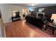 Comfortable living space with hardwood floors, a cozy fireplace, and stylish furnishings at 1005 Timbervale Ln, Lithonia, GA 30058