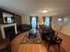 Inviting living room with hardwood floors, a fireplace, comfortable seating, and tasteful decor at 1005 Timbervale Ln, Lithonia, GA 30058