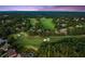Aerial view of a golf course community with lush green fairways and beautiful homes at 5507 Aviemore Ct, Suwanee, GA 30024