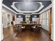 Elegant dining room with dark blue ceiling, hardwood floors, and plenty of natural light at 5507 Aviemore Ct, Suwanee, GA 30024