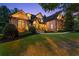 Charming brick home featuring a manicured lawn and inviting entrance enhanced by elegant stonework at 5507 Aviemore Ct, Suwanee, GA 30024