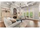 Inviting living room featuring a coffered ceiling, fireplace, and large windows at 5507 Aviemore Ct, Suwanee, GA 30024