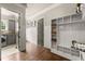 Functional mudroom with storage cubbies, seating, and direct access to laundry area at 5507 Aviemore Ct, Suwanee, GA 30024