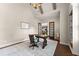 Well-lit home office with a large desk, custom built-ins, and elegant decor at 5507 Aviemore Ct, Suwanee, GA 30024