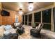 Relaxing screened porch with comfortable seating and outdoor view is ideal for entertaining at 5507 Aviemore Ct, Suwanee, GA 30024