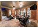 Spacious screened porch with comfortable seating and a large TV, perfect for relaxation at 5507 Aviemore Ct, Suwanee, GA 30024