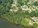 Aerial view of lakefront properties, lush greenery, and serene neighborhoods at 1432 Arbor Bluff Ct, Lawrenceville, GA 30045