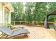 Back deck with lounge chairs, bar seating, and a gazebo overlooking the lush backyard at 1432 Arbor Bluff Ct, Lawrenceville, GA 30045