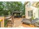 Spacious back deck with bar seating and lounge chairs, great for outdoor entertaining at 1432 Arbor Bluff Ct, Lawrenceville, GA 30045
