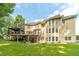 Expansive backyard with a covered deck, gazebo, lush lawn, and mature trees, perfect for outdoor enjoyment at 1432 Arbor Bluff Ct, Lawrenceville, GA 30045