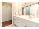 Bathroom with a double sink vanity and a barn door leading to the bath and shower at 1432 Arbor Bluff Ct, Lawrenceville, GA 30045