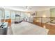 Spacious bonus room featuring hardwood floors, built-in shelves and natural light from many large windows at 1432 Arbor Bluff Ct, Lawrenceville, GA 30045