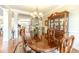Beautiful dining room with hardwood floors, traditional furnishings, and an elegant chandelier at 1432 Arbor Bluff Ct, Lawrenceville, GA 30045