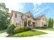 Charming two-story home with beautiful landscaping, stone accents, and a welcoming front porch at 1432 Arbor Bluff Ct, Lawrenceville, GA 30045