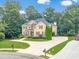 Beautiful two-story home with well-kept yard and mature trees, located on an expansive lot at 1432 Arbor Bluff Ct, Lawrenceville, GA 30045