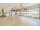 Spacious three-car garage featuring a durable epoxy floor and an automatic door opener at 1432 Arbor Bluff Ct, Lawrenceville, GA 30045