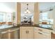 Open-concept kitchen overlooking the living room with granite countertops and stainless steel appliances at 1432 Arbor Bluff Ct, Lawrenceville, GA 30045