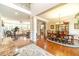 Spacious living room with hardwood floors, neutral paint, elegant furnishings, and an abundance of natural light at 1432 Arbor Bluff Ct, Lawrenceville, GA 30045