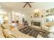 Bright and airy living room featuring a fireplace, comfortable seating, and hardwood floors at 1432 Arbor Bluff Ct, Lawrenceville, GA 30045
