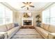 Inviting living room with fireplace, hardwood floors, comfortable seating, and natural light at 1432 Arbor Bluff Ct, Lawrenceville, GA 30045