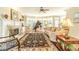 Comfortable living room featuring a fireplace, large rug, neutral paint, and a baby grand piano at 1432 Arbor Bluff Ct, Lawrenceville, GA 30045