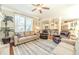 Spacious living room with hardwood floors, ample seating, fireplace, and an open layout concept at 1432 Arbor Bluff Ct, Lawrenceville, GA 30045