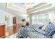 Spacious main bedroom with a lounge area, trey ceiling, many windows, and attached bathroom at 1432 Arbor Bluff Ct, Lawrenceville, GA 30045