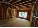 The wood framework reveals a well-lit bedroom with a window, awaiting your final touches at 314 Fortune Ne St # B, Atlanta, GA 30312