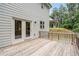 View of wood deck with access to house through double doors and view of backyard and neighboring home at 5394 Pebblebrook Se Ln, Mableton, GA 30126