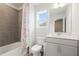 Inviting bathroom featuring a shower-tub combo with tile surround and a single vanity with storage at 5394 Pebblebrook Se Ln, Mableton, GA 30126