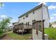 Exterior view from backyard of the home featuring a wood deck and neutral siding at 5394 Pebblebrook Se Ln, Mableton, GA 30126